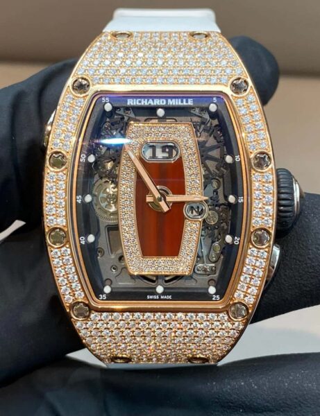 What Stories Hide Behind Richard Mille Rose Gold Icons? 4 Richard Mille RM 037 Rose Gold with diamond-set bezel and skeleton dial, paired with black rubber strap.